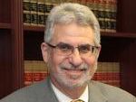 BARRY L. MANUS